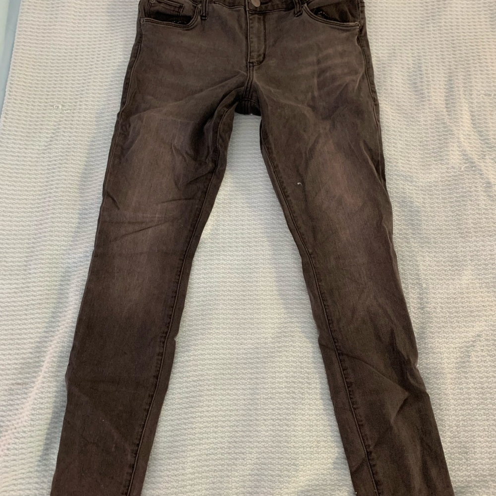 Distressed black skinny jeans